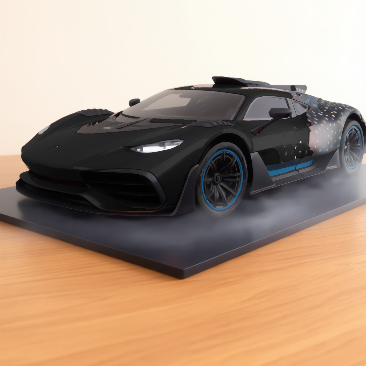 Black GT hypercar mist model on a wooden desk