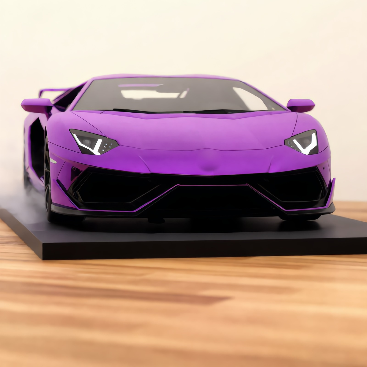 Purple V12 hypercar mist model, front view on a wooden desk