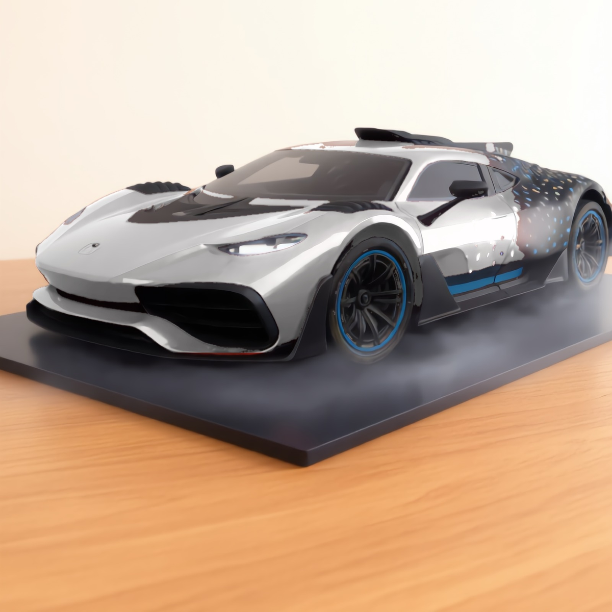 Silver GT hypercar mist model on a wooden desk