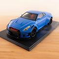 JDM Widebody 1:24 die-cast model with exhaust mist, front view on wooden desk